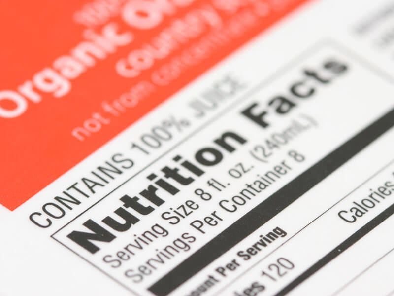 nutrition label on a box of organic orange juice